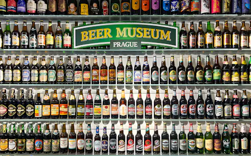 Beer bottles displayed inside Prague Beer Museum.