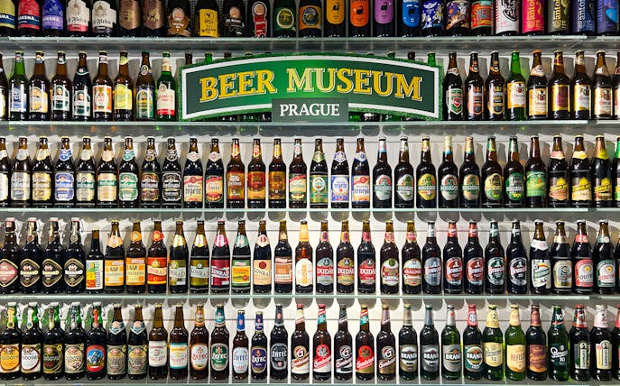 Beer bottles displayed inside Prague Beer Museum.