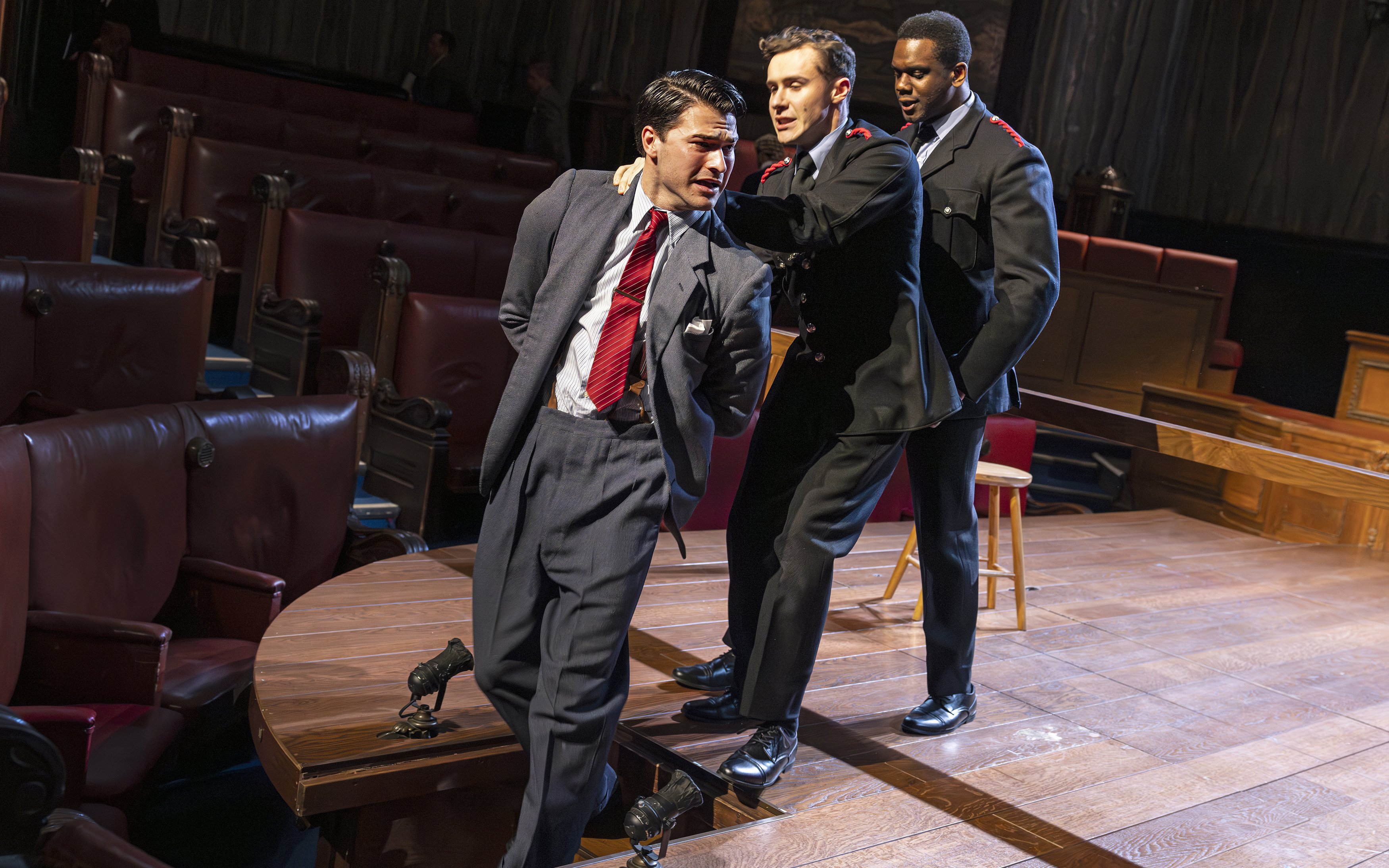 Courtroom scene from "Witness for the Prosecution" performance with actors in dramatic pose.