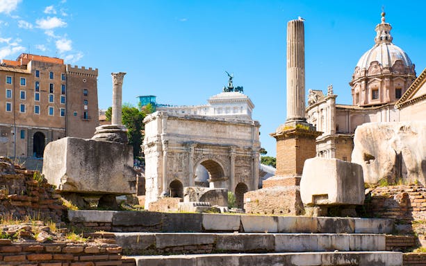Ancient Roman Forum ruins with Arch of Septimius Severus in Rome.