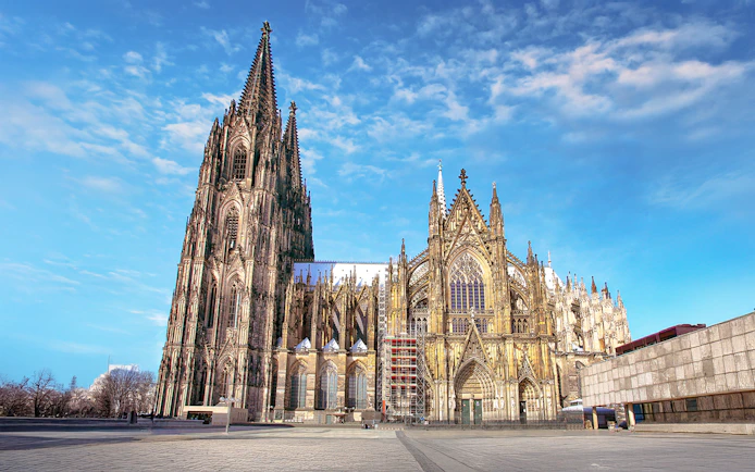 Cologne Cathedral exterior on a sunny day, featured in the City Tour: Cologne Hop-on Hop-off Bus Tour.