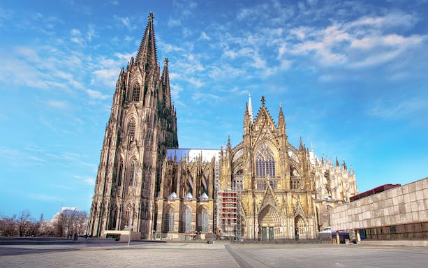 Cologne Cathedral exterior on a sunny day, featured in the City Tour: Cologne Hop-on Hop-off Bus Tour.