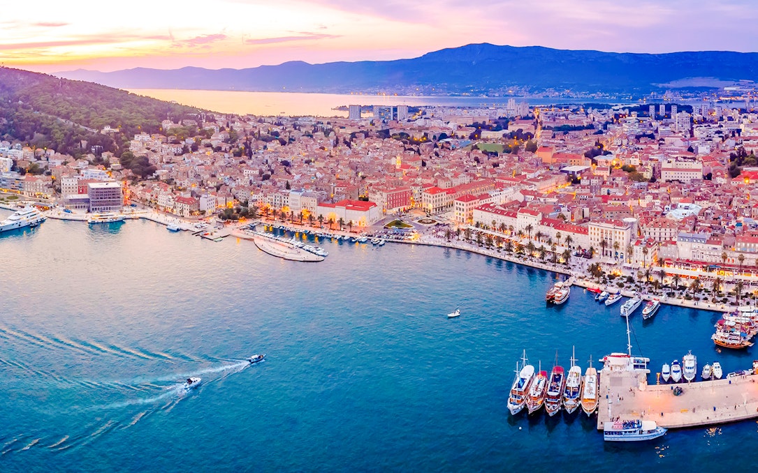 Aerial view of Split, Croatia, showcasing the waterfront and historic buildings.