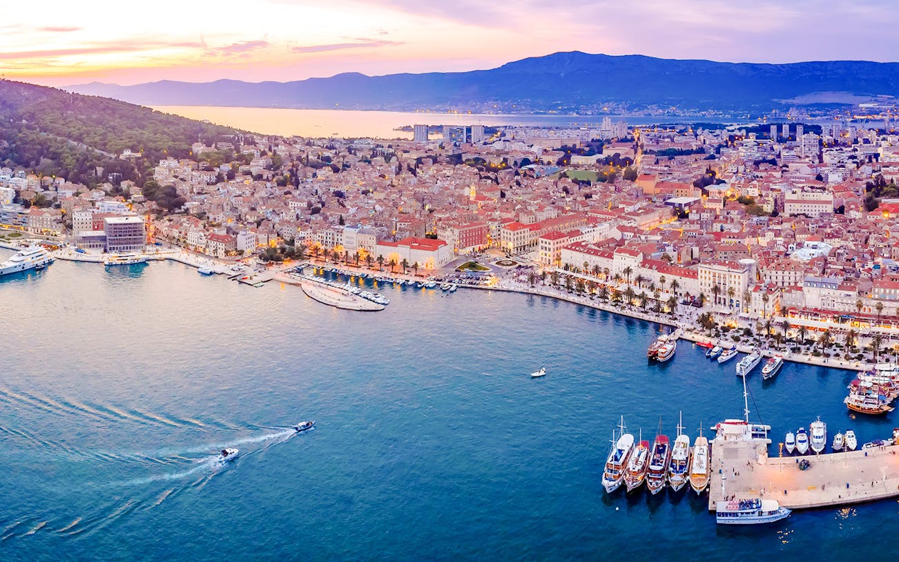 Aerial view of Split, Croatia, showcasing the waterfront and historic buildings.