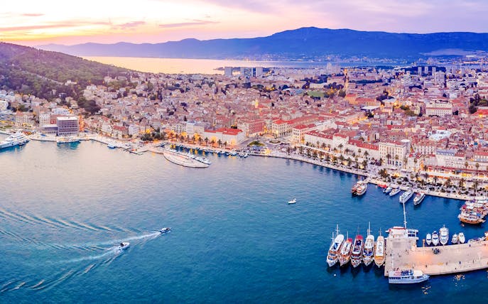 Aerial view of Split, Croatia, showcasing the waterfront and historic buildings.