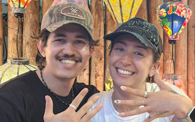Couple showcasing handmade rings at a jewelry workshop in Hoi An.