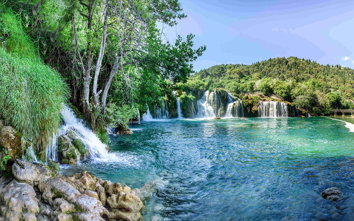 Waterfalls and lush greenery at Plitvice Lakes during a private day tour from Split.