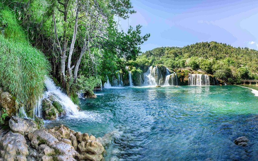 Waterfalls and lush greenery at Plitvice Lakes during a private day tour from Split.