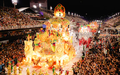Carnival parade with vibrant floats and dancers at Marquês de Sapucaí, Rio de Janeiro.