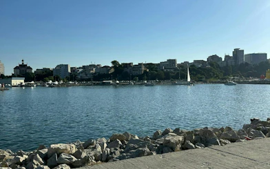 Constanta waterfront with boats and city skyline, part of the Haunted Constanta Black Sea Monster tour.