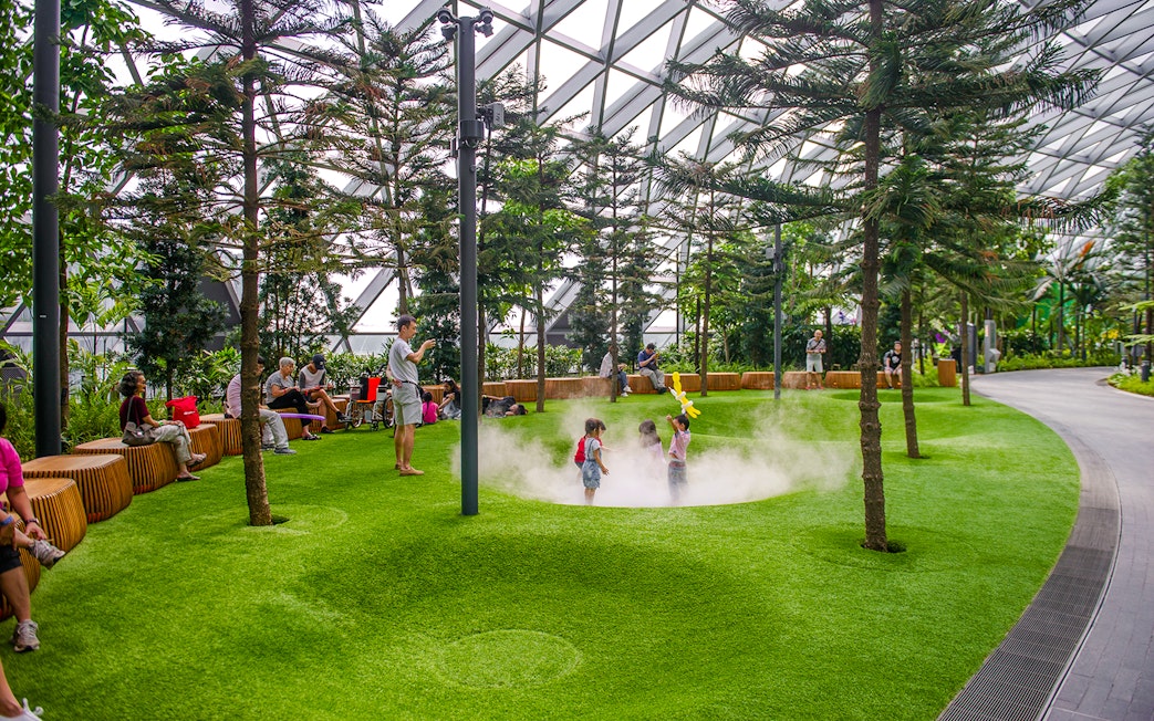 Children playing in Foggy Bowls at Canopy Park, Jewel Changi.