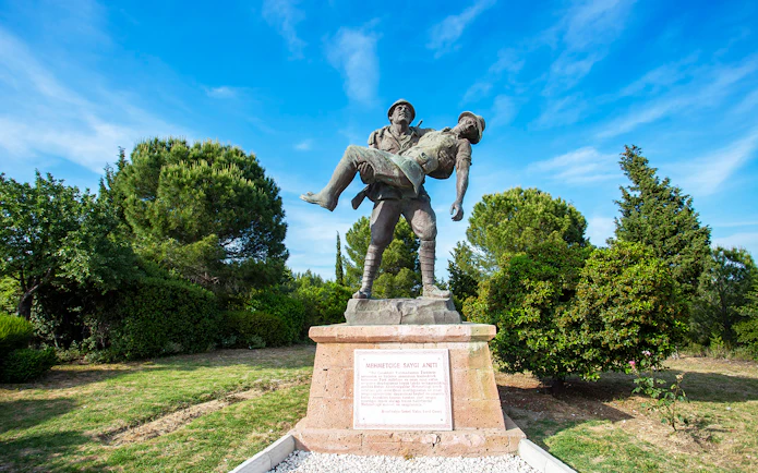 Statue of a soldier carrying a comrade at Gallipoli Peninsula, Turkey, on a day tour from Istanbul.