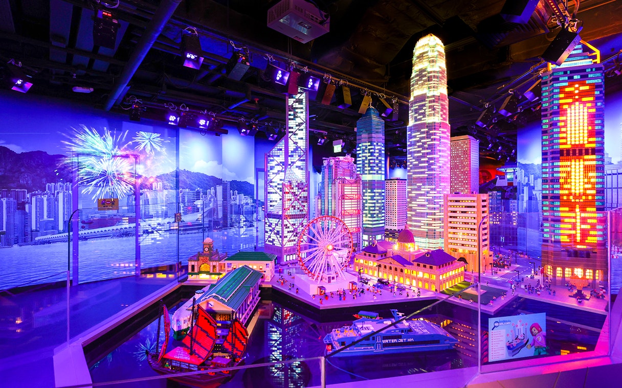 LEGO model of Hong Kong skyline with skyscrapers and ferris wheel at LEGOLAND Discovery Centre.