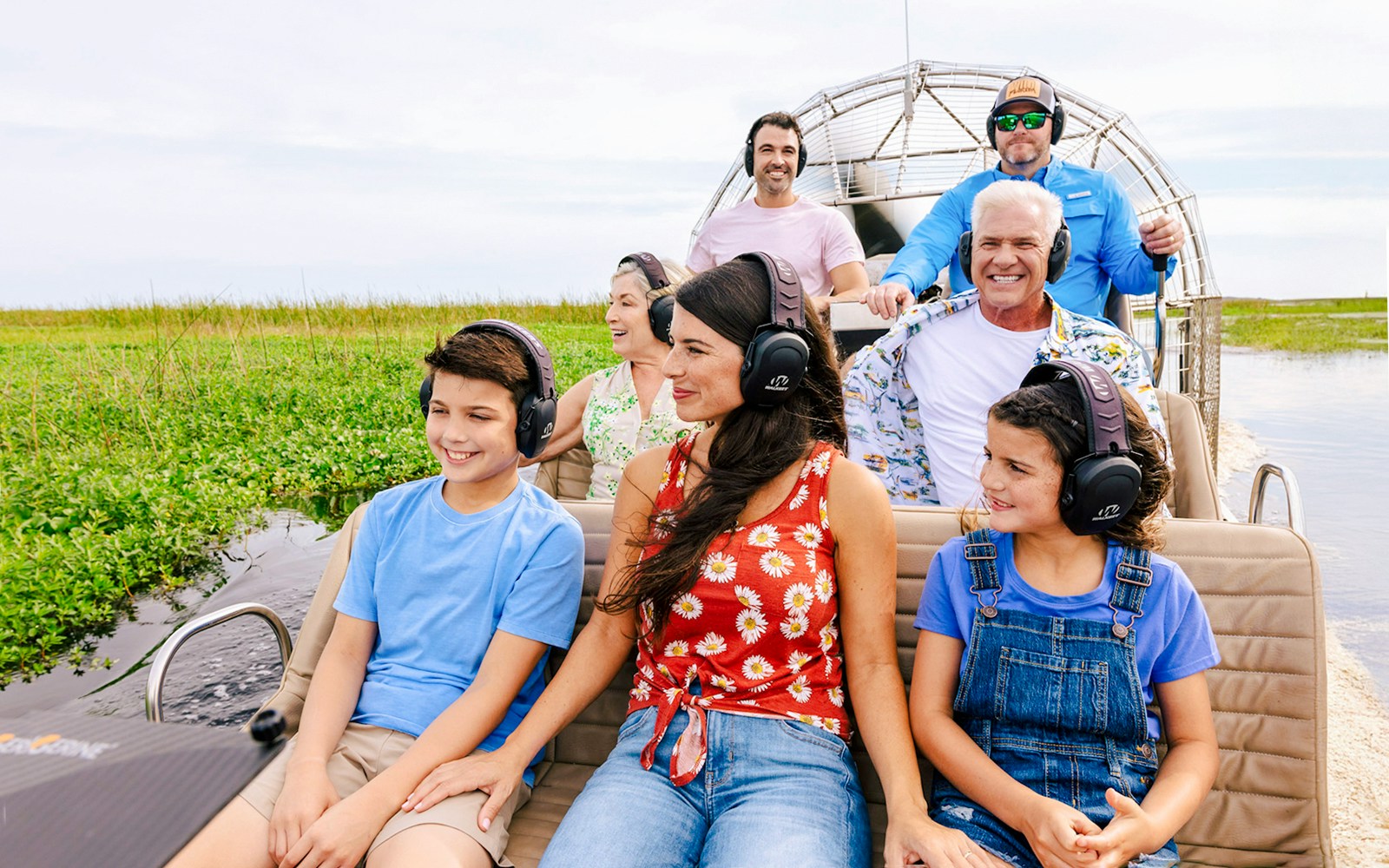 Guests listening to guide during Everglades Airboat Tour.
