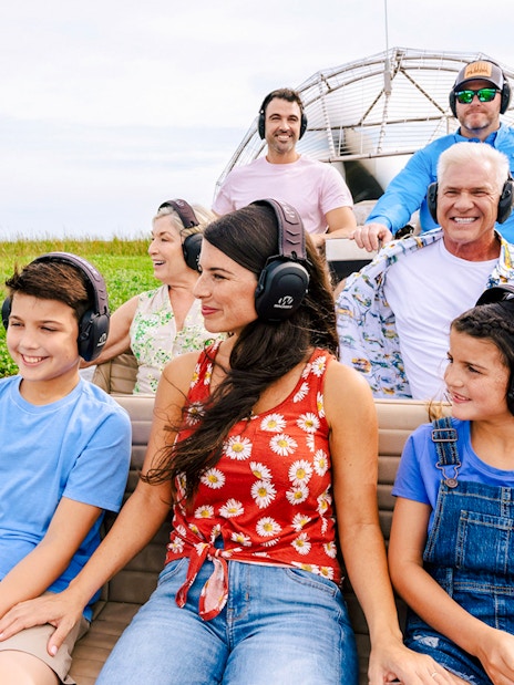 Guests listening to guide during Everglades Airboat Tour.