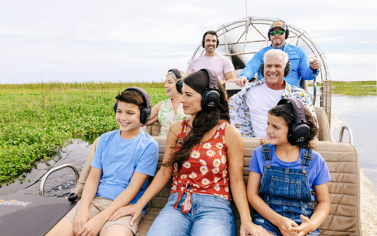 Guests listening to guide during Everglades Airboat Tour.