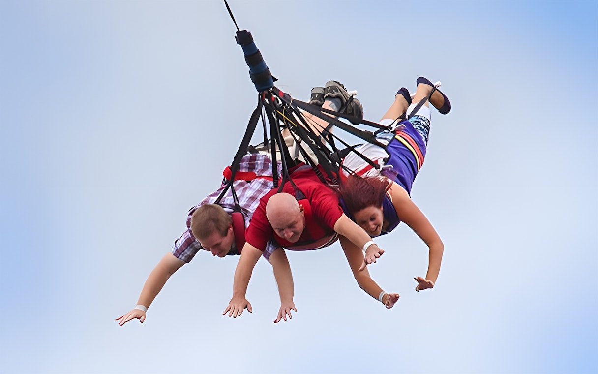 Visitors enjoying a skycoaster ride at Fun Spot America Theme Parks.