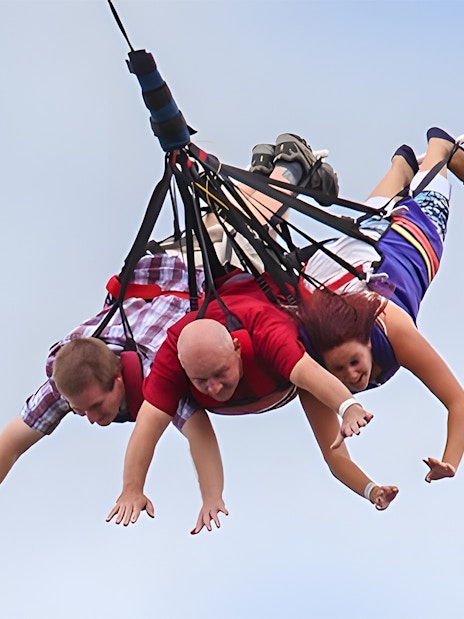 Visitors enjoying a skycoaster ride at Fun Spot America Theme Parks.
