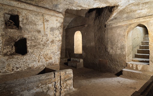 Ipogeo dei Cristallini ancient stone chamber with arched doorway and steps in Naples, Italy.