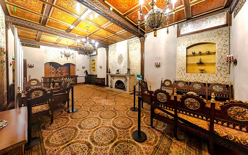Ceaușescu Mansion interior with ornate wooden furniture and decorative ceiling, Bucharest.
