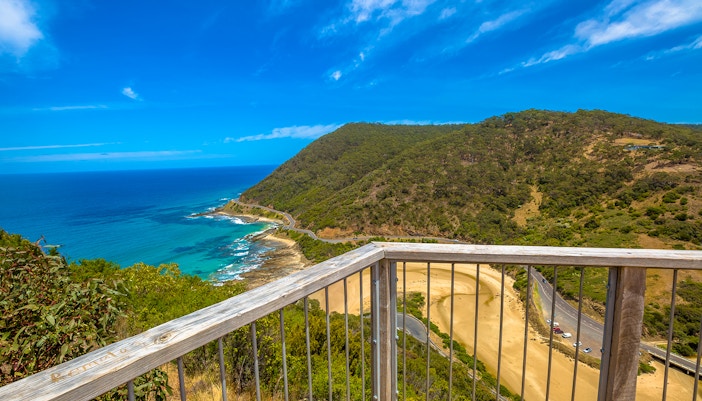 Teddy's Lookout view of Great Ocean Road coastline and lush forest, Australia.