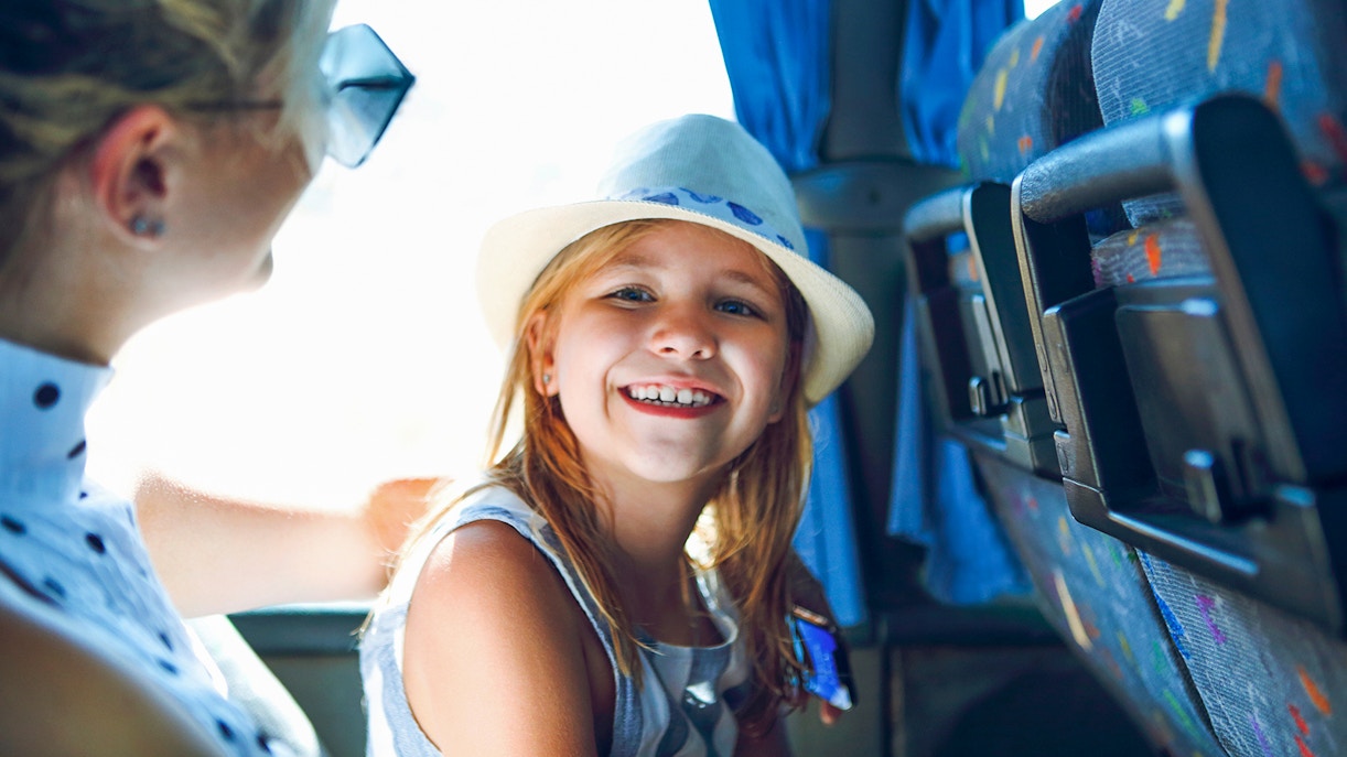 Little girl on the bus on way to Carnival Magic Phuket