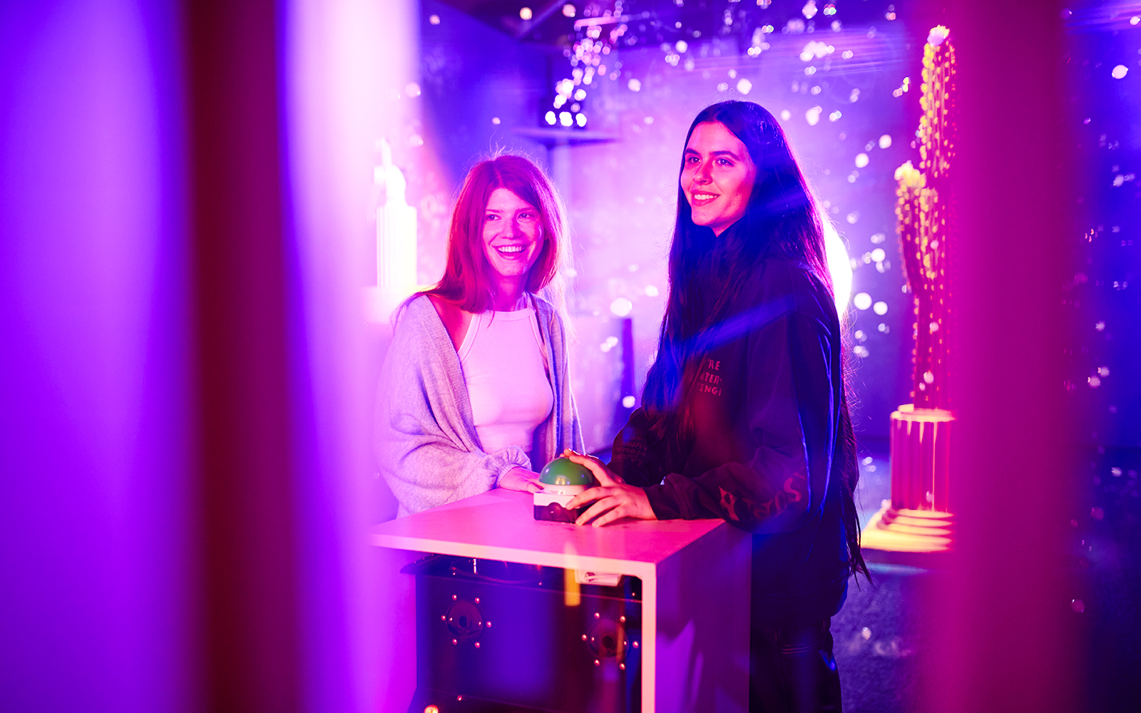 Visitors interacting with an exhibit at Bubble Planet, Washington DC.