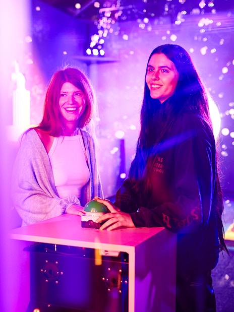 Visitors interacting with an exhibit at Bubble Planet, Washington DC.