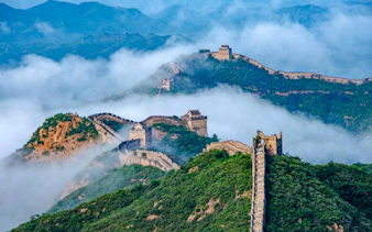 Great Wall of China winding through misty mountains, Beijing.