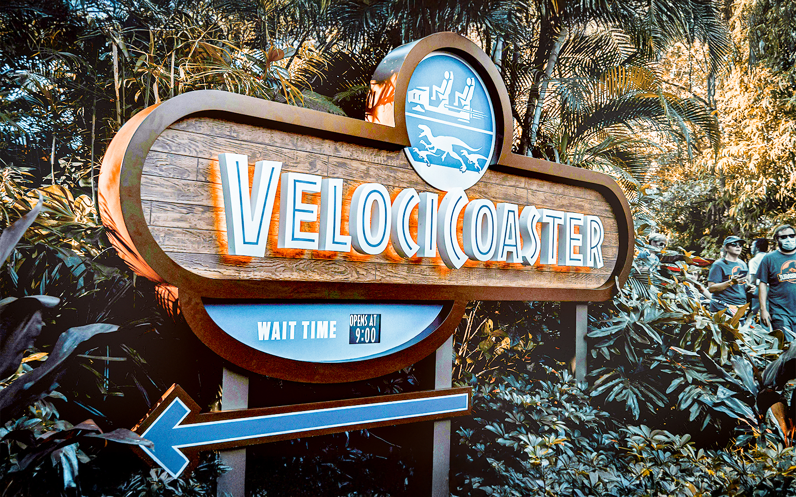 Velocicoaster entrance sign at Universal Orlando, Florida, surrounded by lush greenery.