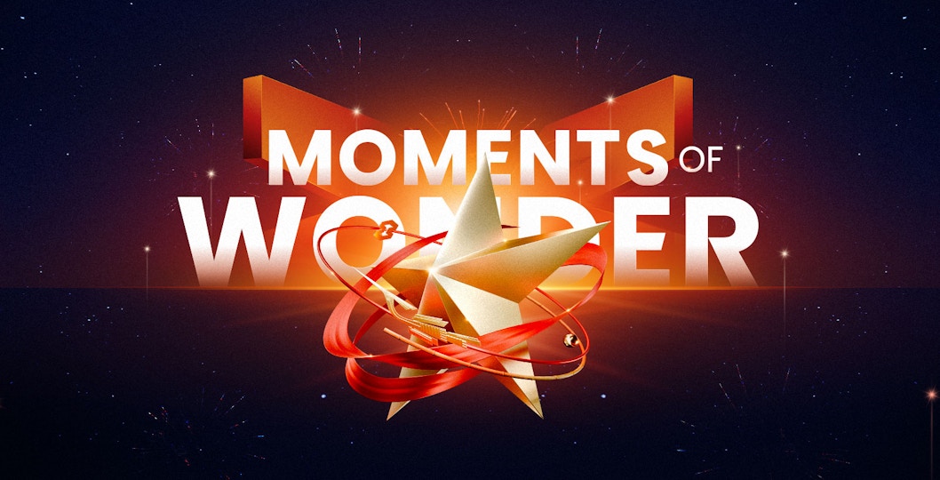 Moments of Wonder text with star and ribbon design on dark background
