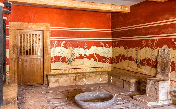 King's chamber of Knossos with frescoes and stone throne, Crete, Greece.