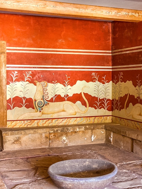 King's chamber of Knossos with frescoes and stone throne, Crete, Greece.