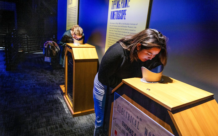 Guests engaging with interactive exhibits inside RiseNY.