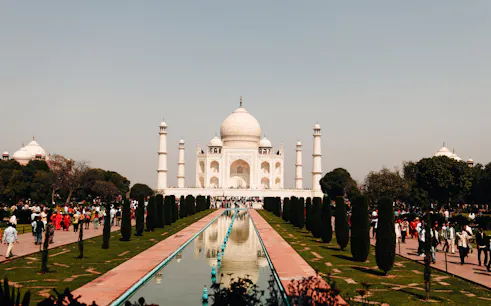 Taj Mahal with reflecting pool and visitors, Agra, part of Same Day Tour from Delhi.