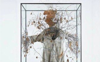 Sculpture with branches and leaves in glass case at Anselm Kiefer Exhibition, Casa Mila.
