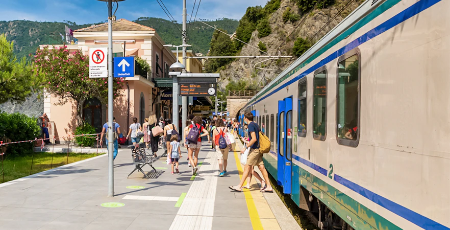 Train station in Cinque Terre with passengers boarding from La Spezia.
