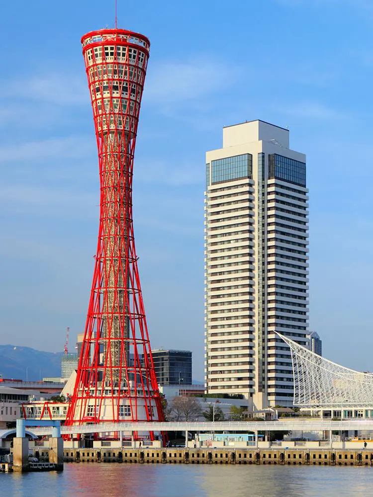 Kobe Port Tower and nearby building by the waterfront in Kobe, Japan.