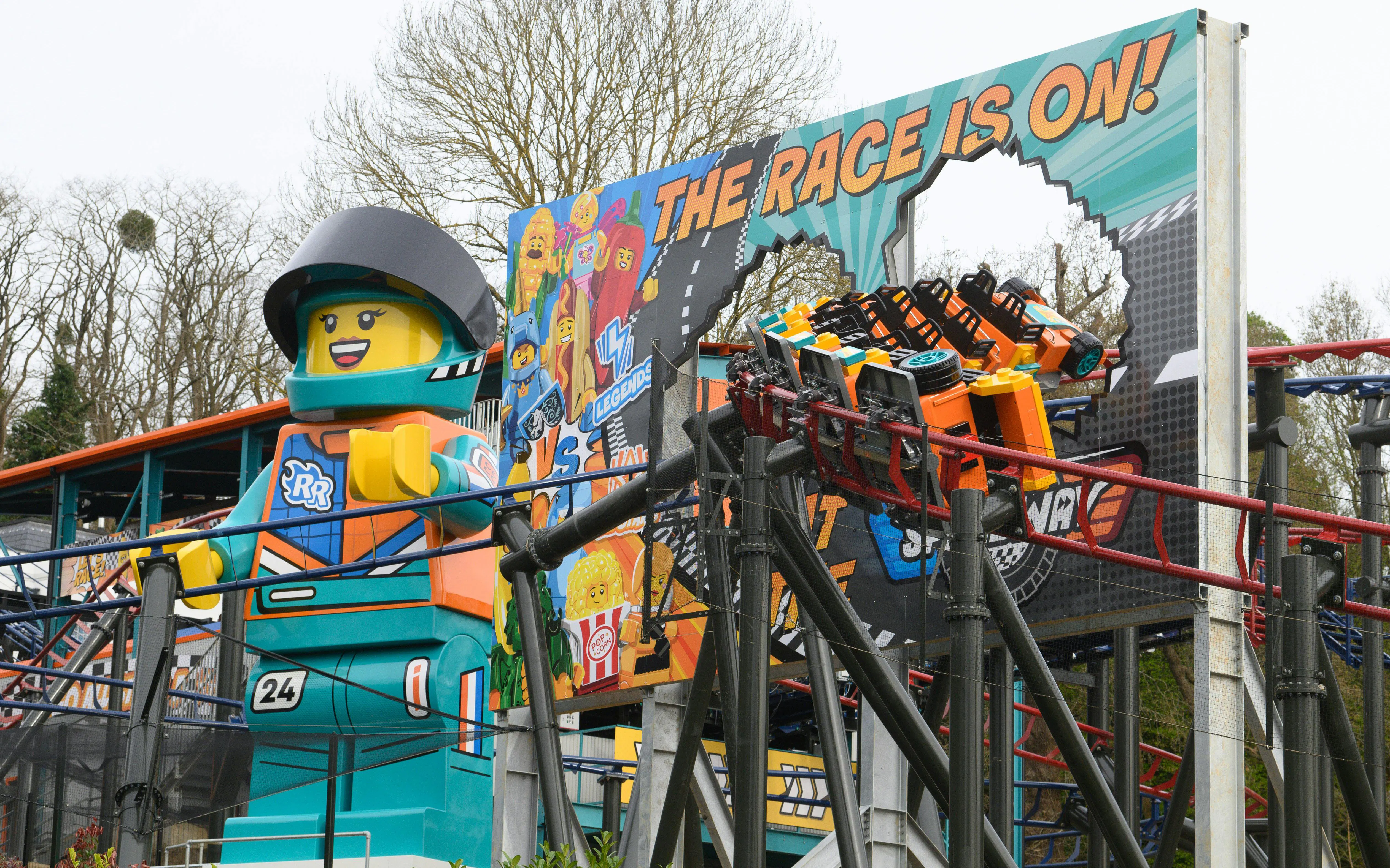 Lego racer statue and roller coaster at Legoland Windsor.