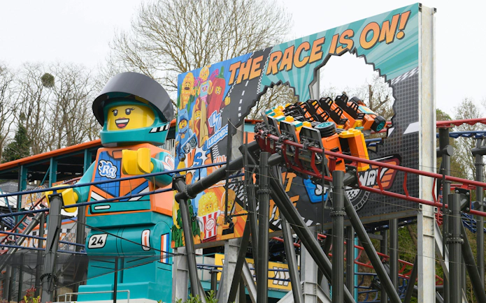 Lego racer statue and roller coaster at Legoland Windsor.