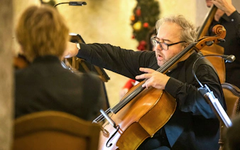 Cellist performing at Fortress Hohensalzburg Christmas Advent Concert.