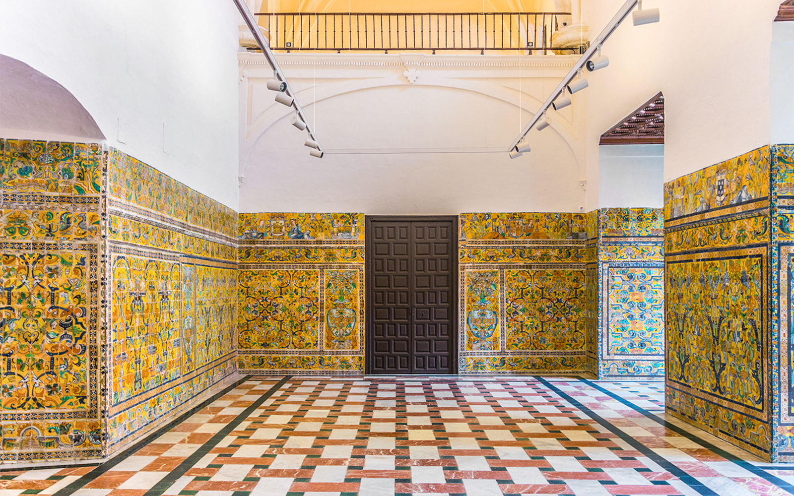 Decorative tile walls inside the Alcázar of Seville, Spain.