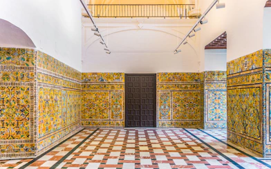 Decorative tile walls inside the Alcázar of Seville, Spain.
