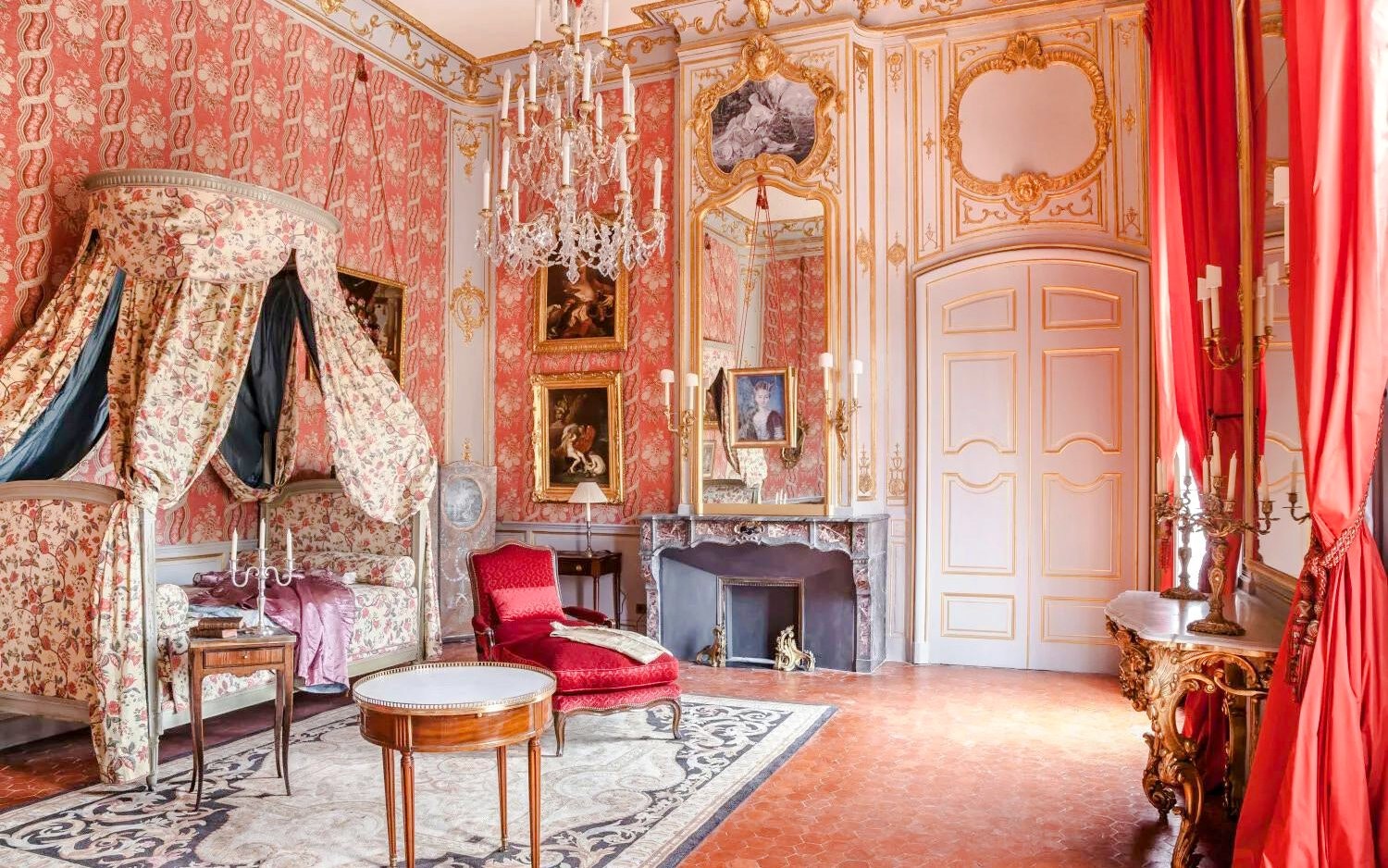 Elegant room with ornate decor and paintings at Caumont Centre d’Art, Aix-en-Provence.