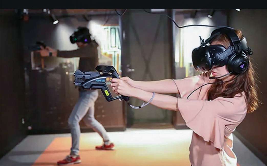 Visitors experiencing virtual reality games at Tokyo JOYPOLIS Theme Park.