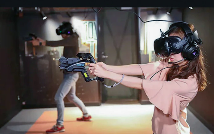 Visitors experiencing virtual reality games at Tokyo JOYPOLIS Theme Park.