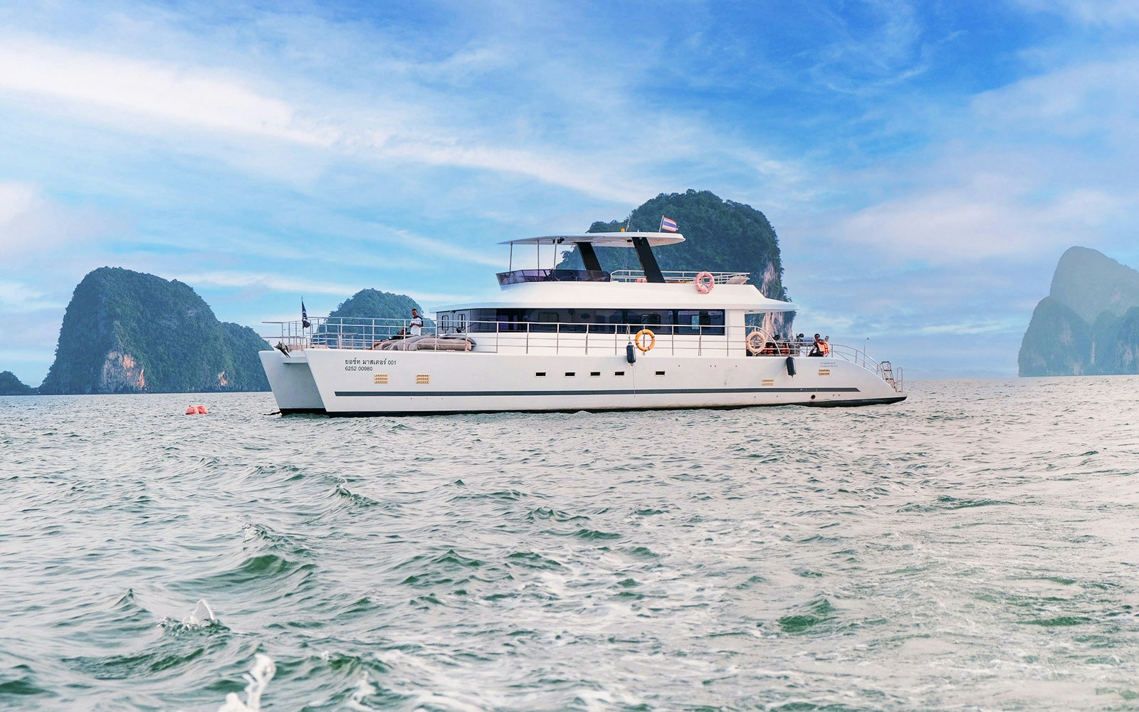 Luxury catamaran cruising near James Bond Island, Thailand.
