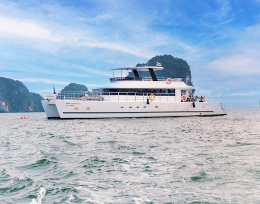 Luxury catamaran cruising near James Bond Island, Thailand.