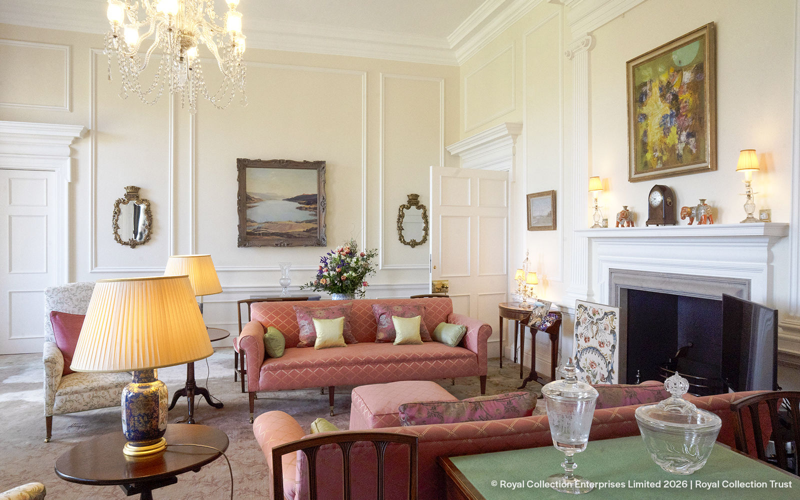 Queen Elizabeth II's private sitting room at Palace of Holyroodhouse with elegant decor.
