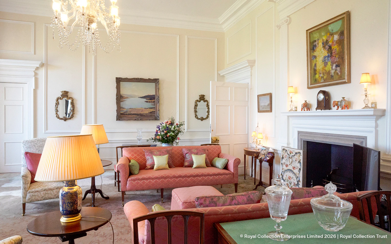 Queen Elizabeth II's private sitting room at Palace of Holyroodhouse with elegant decor.
